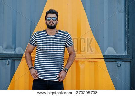 Handsome Tall Arabian Beard Man Model At Stripped Shirt Posed Outdoor. Fashionable Arab Guy At Sungl