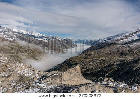 Monte Moro Pass From Switzerland Into Italy And The Stausee Lake Near Saas Fee In The Southern Swiss