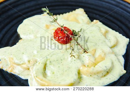 Ravioli With Salmon In Creamy Sauce With Pesto