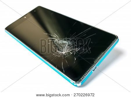 Smartphone With A Broken Screen Isolated On White Background. Phone Repair Concept Closeup.