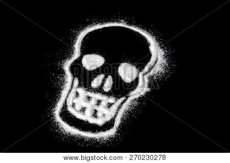 Danger Of Sugar. Harm White Sugar Concept Forming A Skull. With Text Isolated On A Black Background.