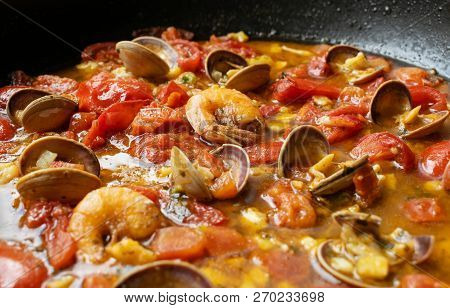 Shrimp In A Tomato Sauce With Mollusks. Italian Cuisine. Seafood Closeup View. Stock Image.