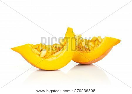 Group Of Two Slices Of Fresh Red Kuri Pumpkin Hokkaido Variety With Seeds Isolated On White Backgrou