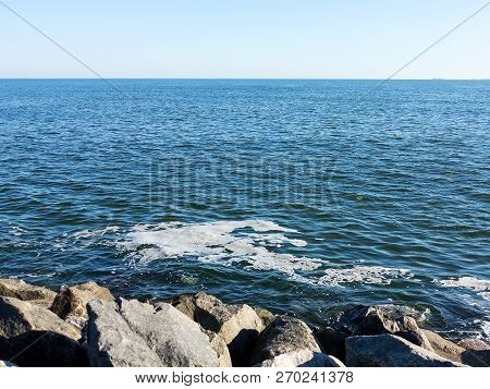 Full Frame Take Of Some Extremely Polluted Waters. Dirty Sea Water. Dirt On Water. Dirty Oil Spots O