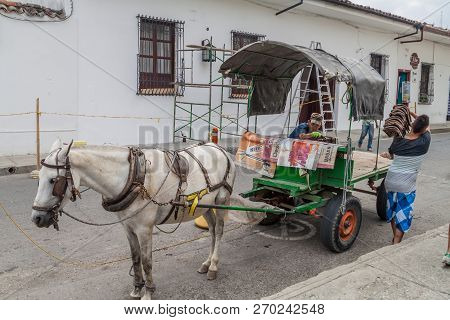 Popayan, Colombia - September 11, 2015: Horse Carriage On A Street In Popayan