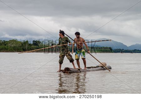 Madidi, Bolivia - May 7, 2105: Tourist With A Tour Guide On Beni River In Madidi National Park, Boli
