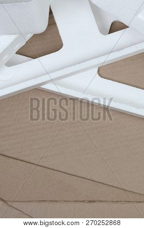 Background Image With Beige Cardboard Paper And Styrofoam Boxes Disgarded As Rubbish. The Concept Of