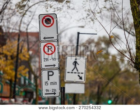Typical North American Paking And No Parking Signs With Detailed Instructions On The Parking Regulat