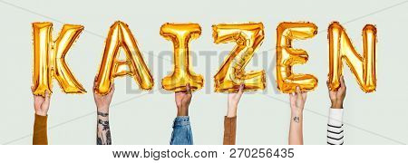 Hands holding Kaizen word in balloon letters