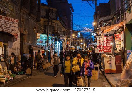 La Paz, Bolivia - April 23, 2015:  People Walk On A Night Stret In The Center Of La Paz, Bolivia.