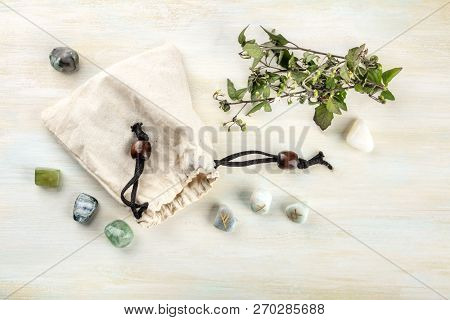 Runes, Stones With Symbols Used In Wicca And Other Magic And For Divination, Tossed From A Bag, Shot