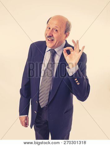 Portrait Of Last Day At Work Of Happy Senior Businessman Excited About His Retirement