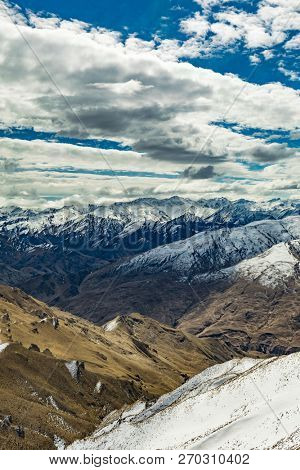 New Zealand mountain panorama and snow ski slopes as seen from Coronet Peak ski resort, Queenstown