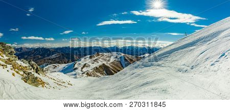 New Zealand mountain panorama and snow ski slopes as seen from Coronet Peak ski resort, Queenstown