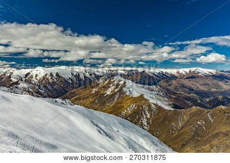 New Zealand mountain panorama and snow ski slopes as seen from Coronet Peak ski resort, Queenstown