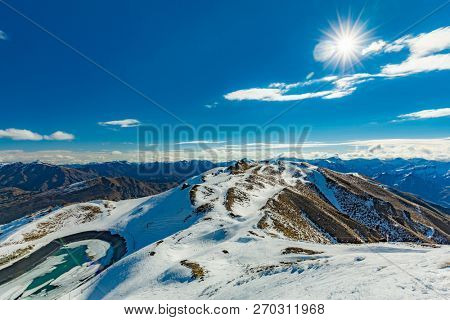 New Zealand mountain panorama and snow ski slopes as seen from Coronet Peak ski resort, Queenstown