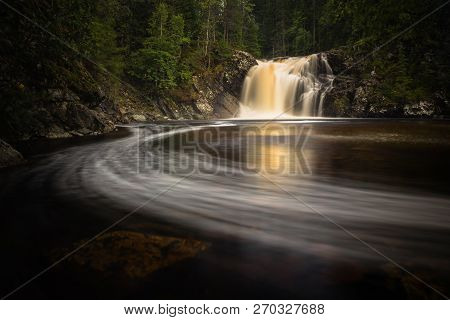 Long Exposure Shot Of Flowing River Homla And Waterfalls.