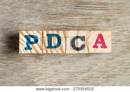 Letter Block In Word Pdca (business Abbreviation Of Plan Do Check Act)  On Wood Background