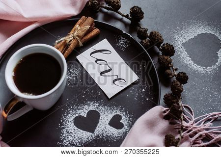 Valentines Day With Cup Of Coffee, Bumps,skarf, Cinnamon And Heart On Gray Table From Above In Flat 