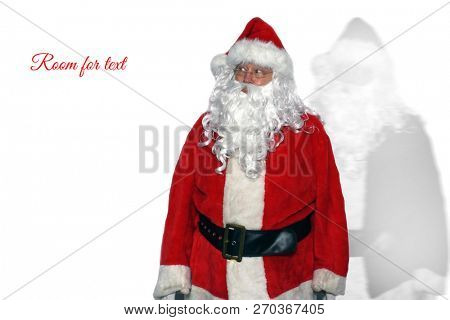 Santa Claus. Santa Claus with a Black and White Shadow, or Soul, or Ghost or his Evil Twin also known as his Doppelganger. Isolated on white. Room for text or images.