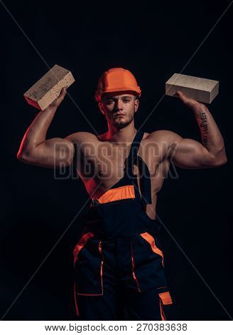 Building Up Great Things. Construction Worker Or Builder At Work At Building Site. Bricklayer Worker