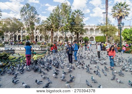Arequipa, Peru - May 26, 2015: People And Pigeons At Plaza De Armas Square In Arequipa, Peru.