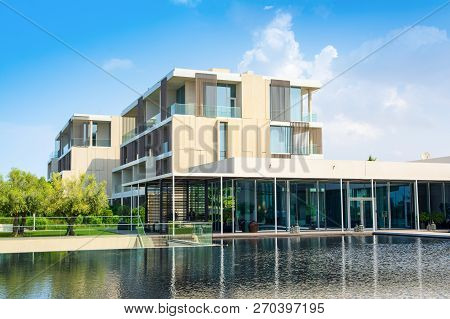 Ajman, United Arab Emirates - 30 October 2018: Landscape With Modern Design Buildings, Lagoon Pool A