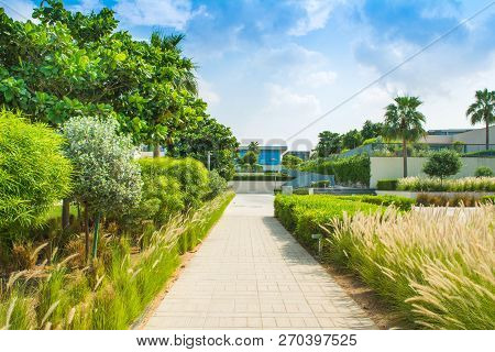 Ajman, United Arab Emirates - 30 October 2018: Landscape With Modern Design Villas And Garden In A L