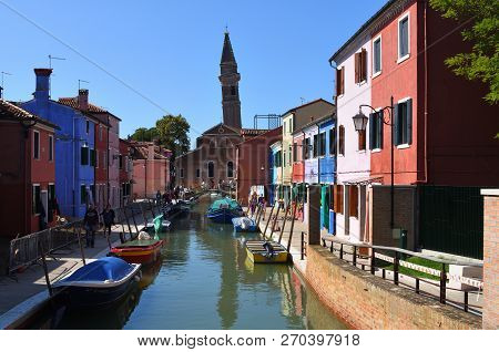 Burano, Venice, Italy -  September 21, 2017:  Colorful Houses Boats And Canal Of Burano Island In Th