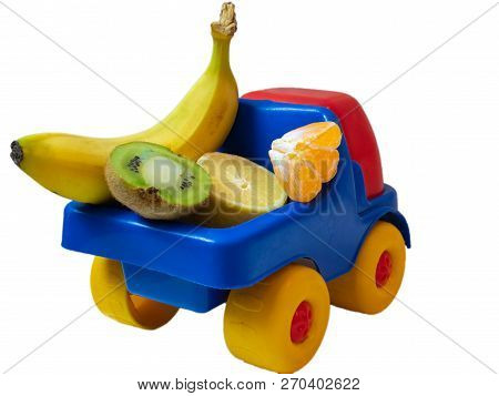 Few Exotic Fruits On Toy Car Truck Ogranic Food
