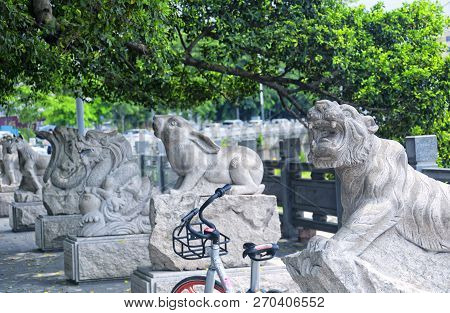Chinese Zodiac Animal Statues Along A Water Canal In The Longhua District Of Shenzhen China.