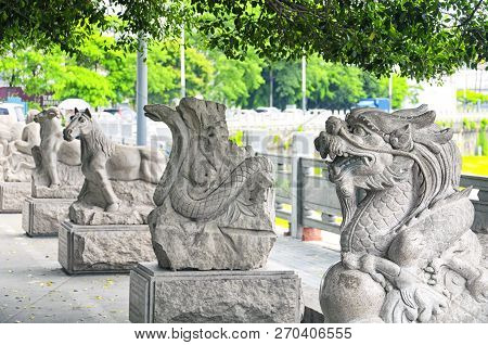 Chinese Zodiac Animal Statues Along A Water Canal In The Longhua District Of Shenzhen China.