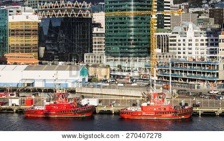 Wellington, New Zealand - August 24, 2017: Cityscape View Of The Capital City Including Two Red Tug 