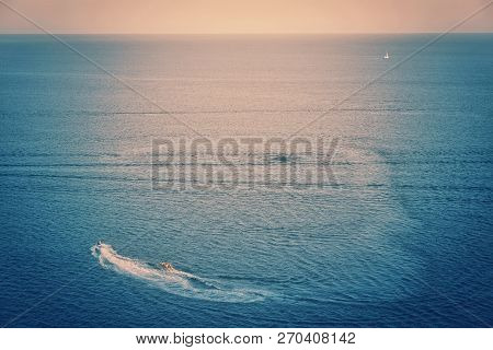 Sunset Time Over Blue Orange Black Sea Background