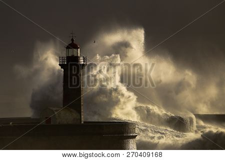 Big Storm With Big Waves Near A Lighthouse