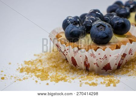 Tartlets With Blueberries Isolated On A Light Background.