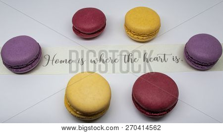 Macaroon Close-up With Decorative Ribbon Isolated On Light Background.