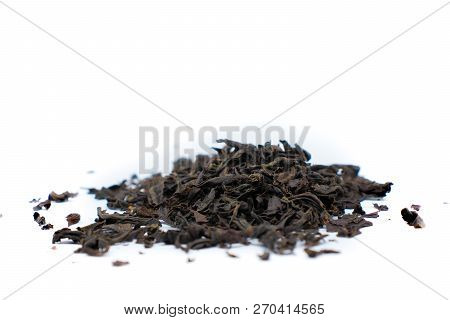 A Handful Of Black Tea Close-up Isolated On White Background