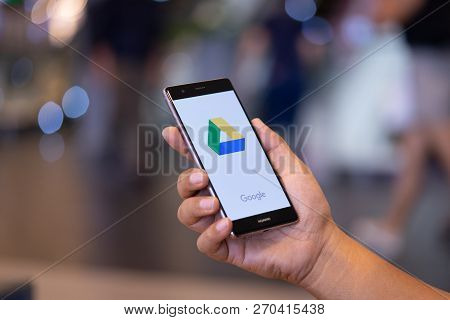Chiang Mai, Thailand - Oct. 28,2018: Man Holding Huawei With Dropbox On Screen. Dropbox Is A Service