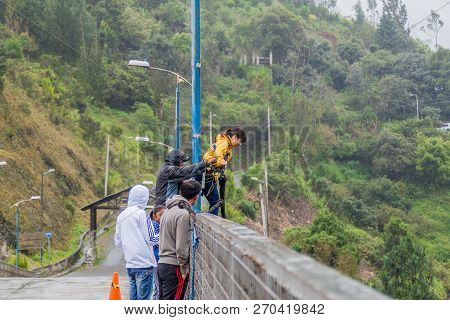 Banos, Ecuador - June 20, 2015: People Performing Bridge Jumping Puenting On San Francisco Bridge In