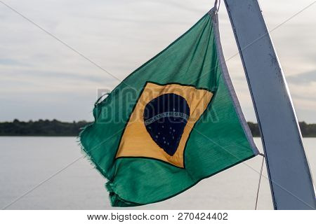 Flag Of Brazil On A River Boat On Amazon River