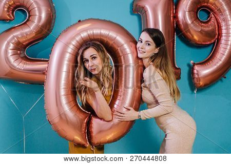 Happy New Year And Merry Christmas Beautiful Young Women With Balloons.