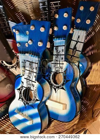 Little Blue Ukeleles In A Basket Sold As Souvenirs