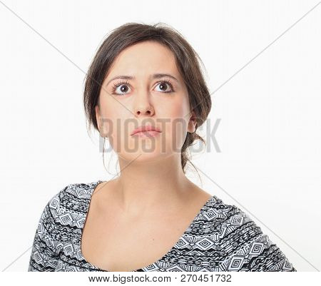Cute Young Brunette Looking Upwards, Isolated On White