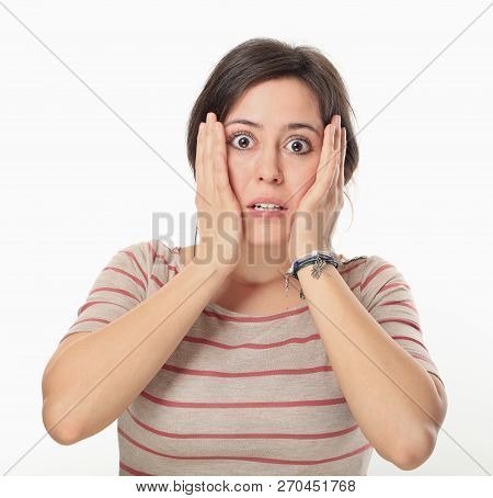 Excited Young Woman Holding Hands Her Head And Does Not Know What To Do