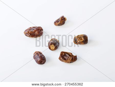 Dried Halawi Dates On A White