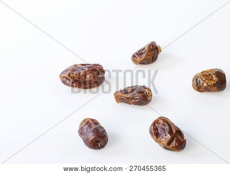 Dried Halawi Dates On A White