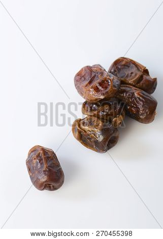 Dried Halawi Dates On A White