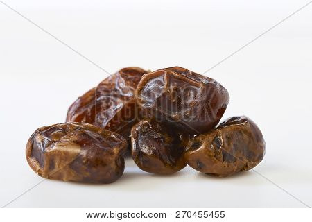 Dried Halawi Dates On A White