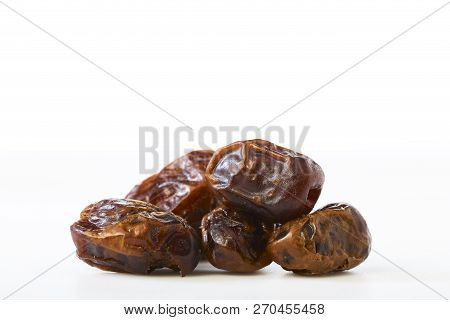 Dried Halawi Dates On A White